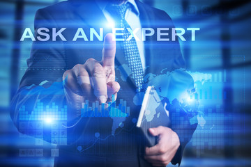 Businessman is pressing on the virtual screen and selecting Ask an expert.
