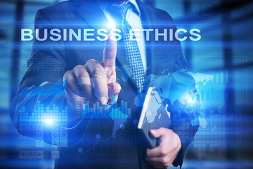 Businessman is pressing on the virtual screen and selecting Business ethics.