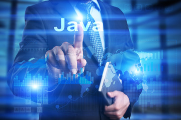 Businessman is pressing on the virtual screen and selecting Java.
