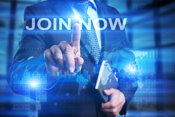 Businessman is pressing on the virtual screen and selecting Join now.