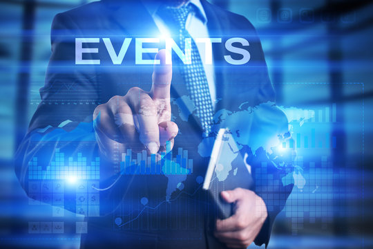 Businessman is pressing on the virtual screen and selecting Events.