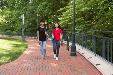 2 young african american college student chatting on campus