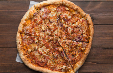 pizza on a wooden background - 116126859