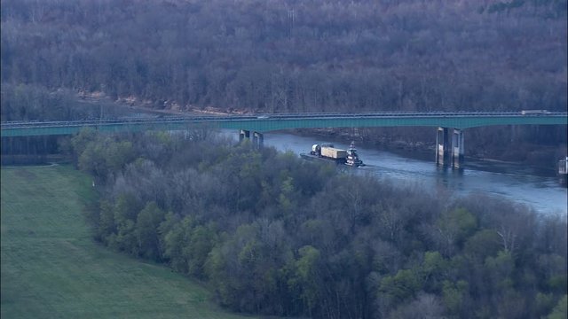 Tug And Barge Under Bridge On River Tombigbee