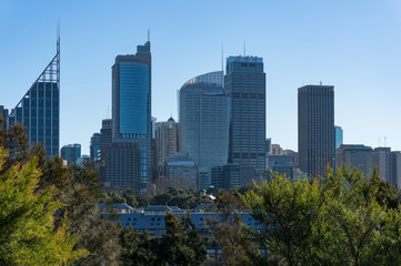 Fototapeta na wymiar Fingers wharf with Sydney downtown skyline skyscrapers on sunny day