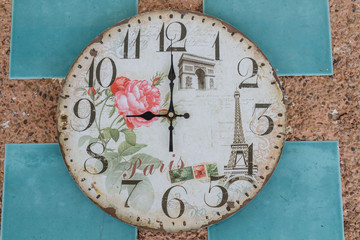 Vintage clock show 9 am or pm on wall background.