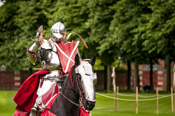 Armored knight suited for battle on horseback, charging in gallop. Galloping it’s the fastest...