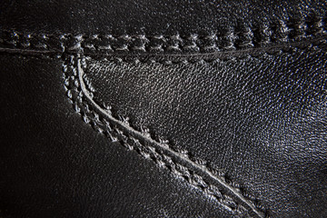 seams on leather black shoes