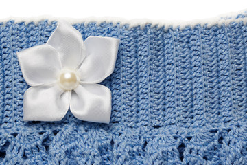 Obraz na płótnie Canvas Blue knitted skirt with flower