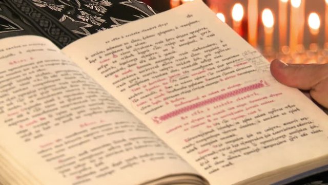 The Bible in expanded form, against the Church of candles in the Orthodox Church.
