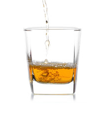 Glass of scotch whiskey  on a white background