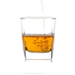 Glass of scotch whiskey  on a white background