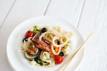 Japanese seafood with chopsticks free space. Plate with traditional meal in Japan, restaurant service