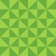 Seamless geometric pattern of sequins, flickering triangles and vertical lines. Background of green triangles. Abstract geometric pattern