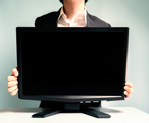 テレビを持つビジネスマン