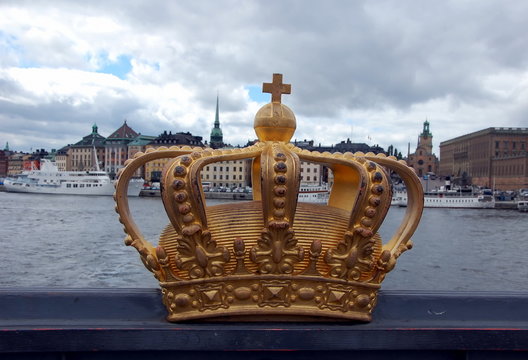 A golden Royal Crown on the Skeppsholmsbron bridge in Stockholm, Sweden