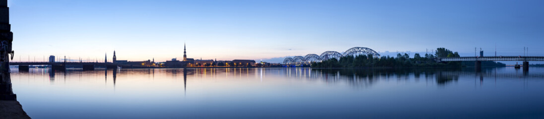 Fototapeta na wymiar View on Riga cityline panorama in early morning over river Daugava. Panoramic montage from 11 images.