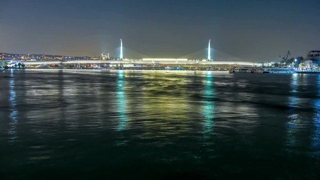 Movement of ships under the  Ataturk Bridge at night. Istanbul, Turkey. Timelapse. 