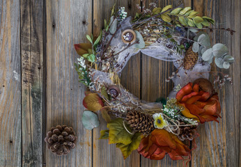 autumn wreath on wooden background in the form of a circle