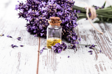 Obraz na płótnie Canvas spa massage setting, lavender product, oil on nature background