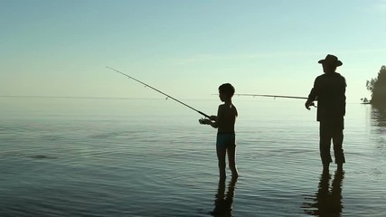 Father and son fishing on the lake.