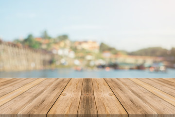 Wooden board empty table in front of blurred background. Perspective brown wood over blur wooden...
