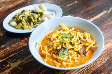 Curried Noodle Soup (Khao soi) with spicy coconut milk, Noodle Soup with beef. Curried noodle. Noodle Thai cuisine northern style. Thai food.