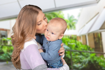 Happy young mother and her son