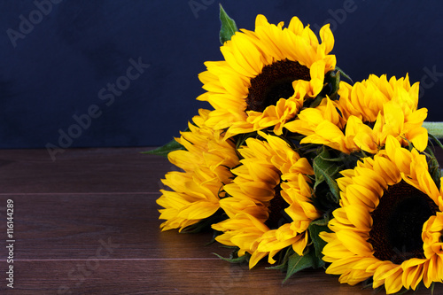 "Yellow sunflower on against a rustic background" Stock photo and