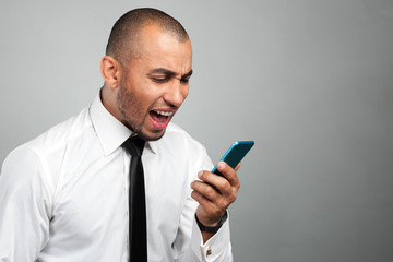 young and black man yelling at the cellphone