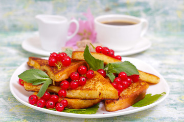 French toast. Homemade Sugar and Cinnamon Toast for Breakfast with red currant and mint