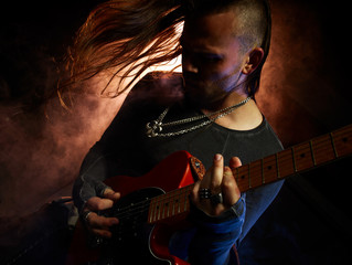 The guitarist plays solo.