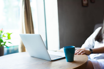 A young woman working with laptop.