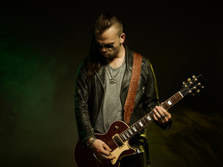The guitarist plays solo.
