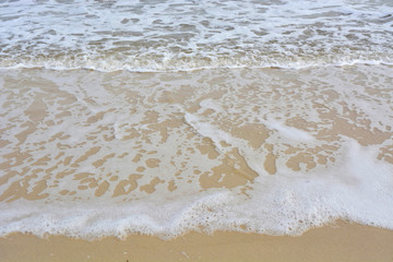 Fototapeta na wymiar Wave ripples on sandy beach.