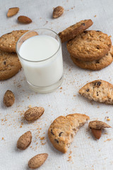 Cookies pile with chocolate chip and almond on light textile background. Delicious morning snacks for breakfast, brunch and lunch. Appetizing, healthy and fast food
