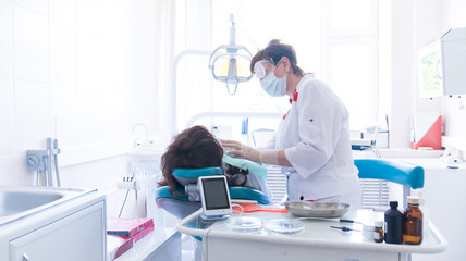 Fototapeta premium Dentist treats a patient