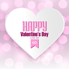 Happy Valentine's day message on white paper heart with pink defocused bokeh background