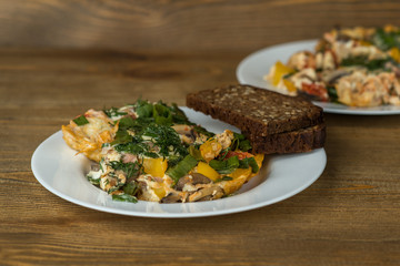 omelet eggs on a plates on wooden table
