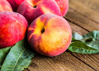 fresh peaches on wood background