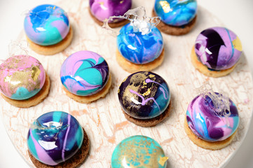 Vibrant cupcakes on white background