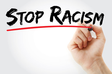 Hand writing Stop Racism with marker, concept background