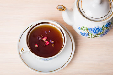Cup of tea with teapot in vintage style