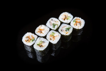 Japanese rolls on black background