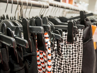 Obraz premium Clothes on hangers in clothing store