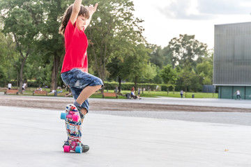 Fototapeta premium outdoor portrait of young smiling teenager boy riding short mode