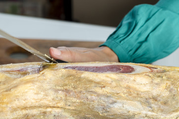 Slicing Spanish jamon iberico (serrano ham)