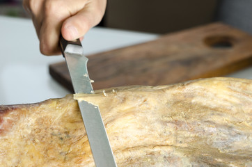 Slicing Spanish jamon iberico (serrano ham)