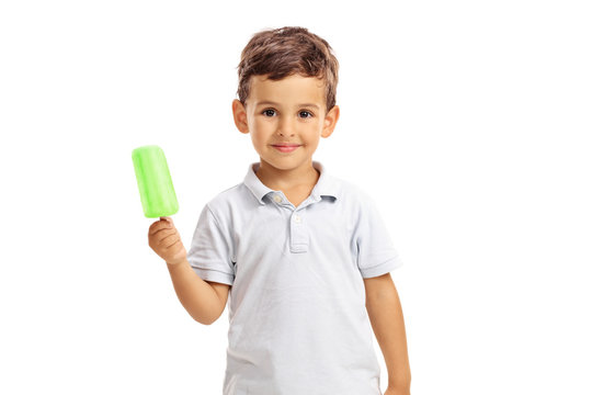 Little kid holding a green popsicle