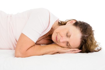 Woman sleeping on white sheet